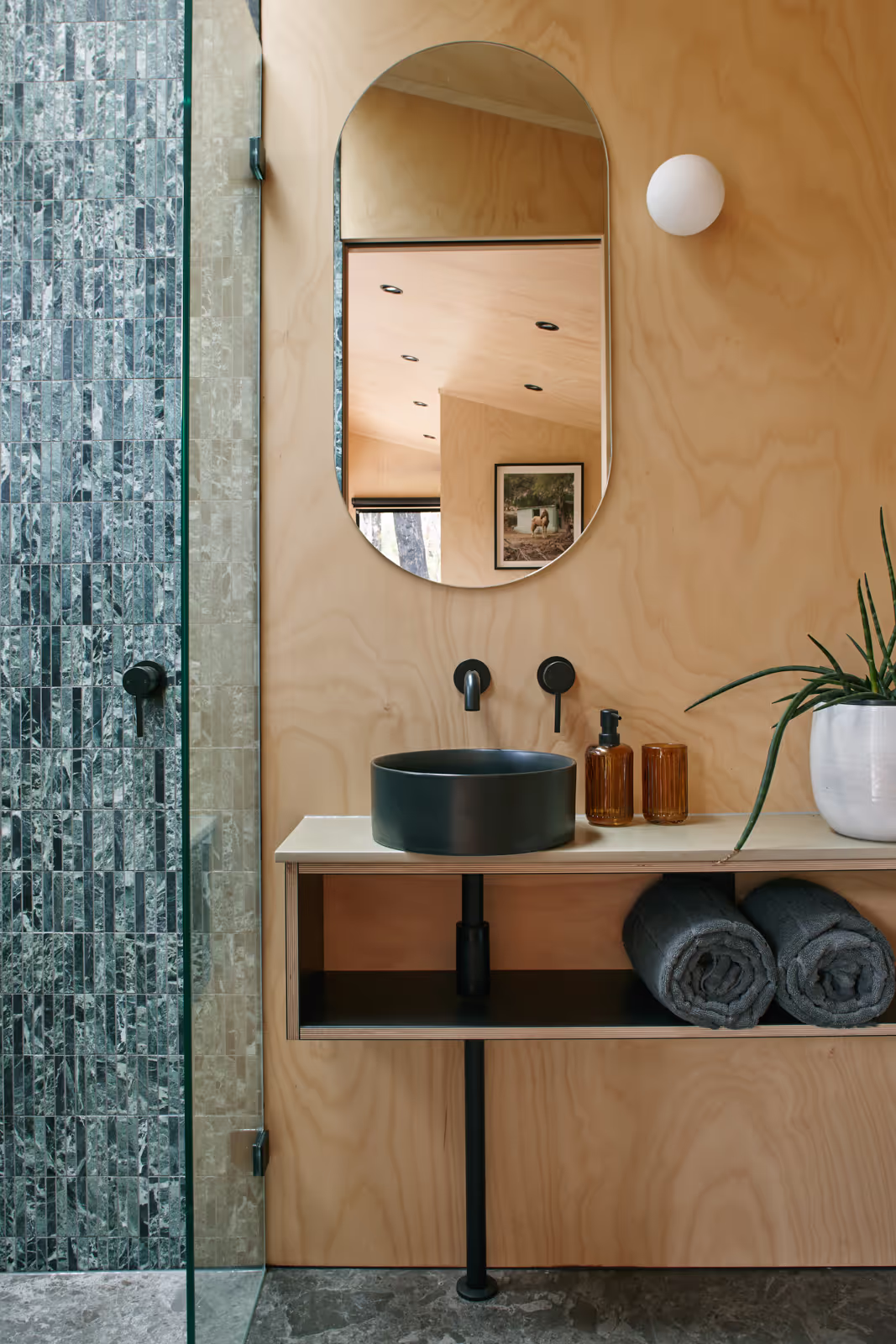 tall tiny house interiors showing luxurious bathroom with fine joinery and marble tiles
